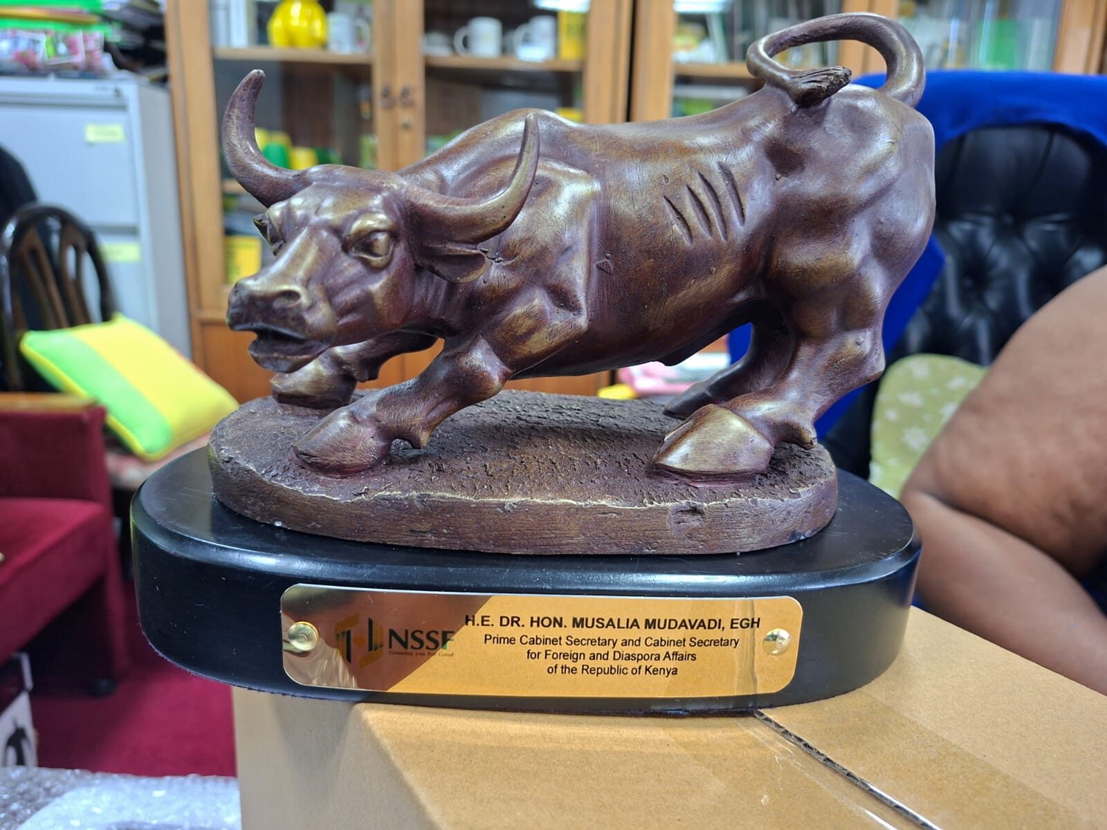Custom bronze bull trophy mounted on a wooden base with engraved plaque