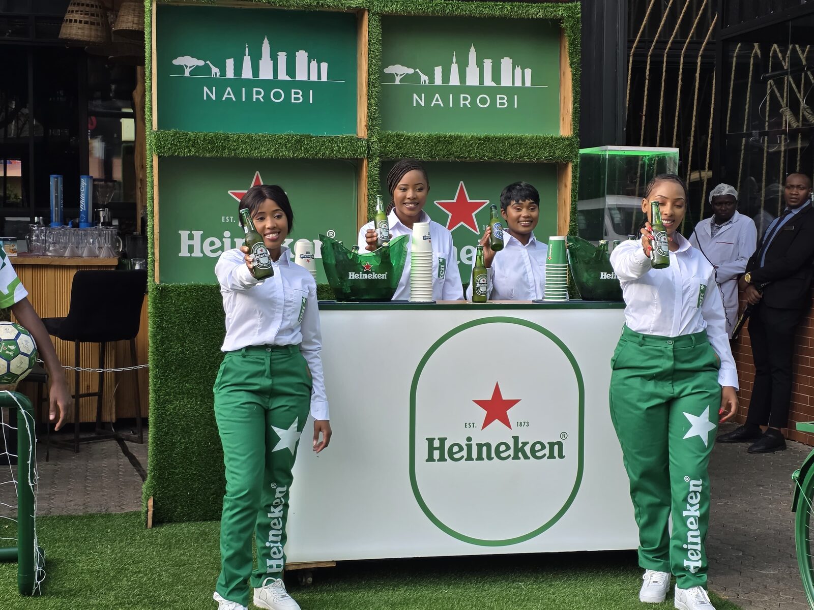 Heineken brand ambassadors at a promotional activation stand in Nairobi